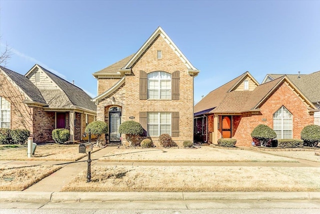 view of front of property featuring brick siding