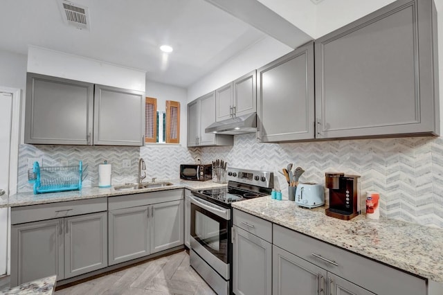 kitchen featuring gray cabinets and stainless steel electric stove