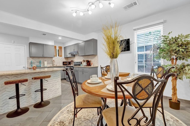 dining room with recessed lighting and visible vents