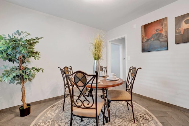 dining room featuring baseboards