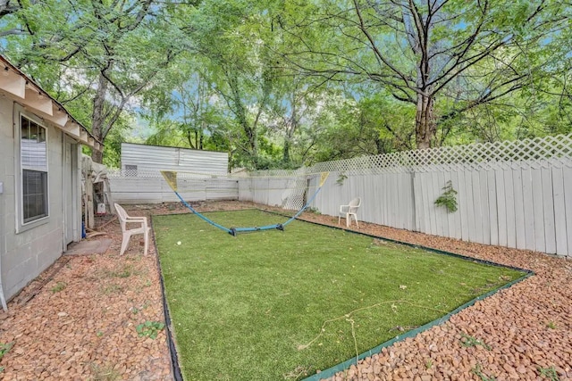 view of yard with a fenced backyard