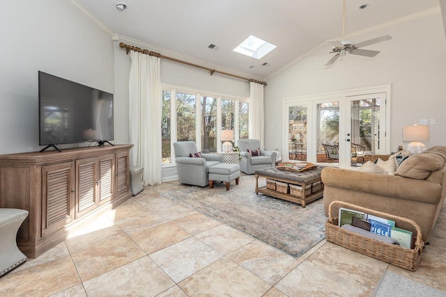 living room featuring ornamental molding, a skylight, and plenty of natural light