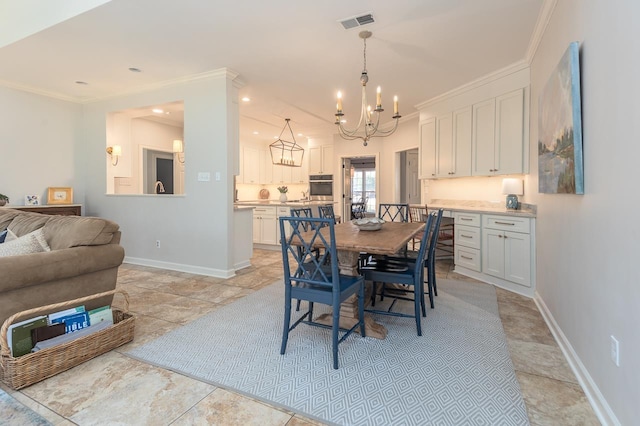 dining area featuring visible vents, crown molding, and baseboards