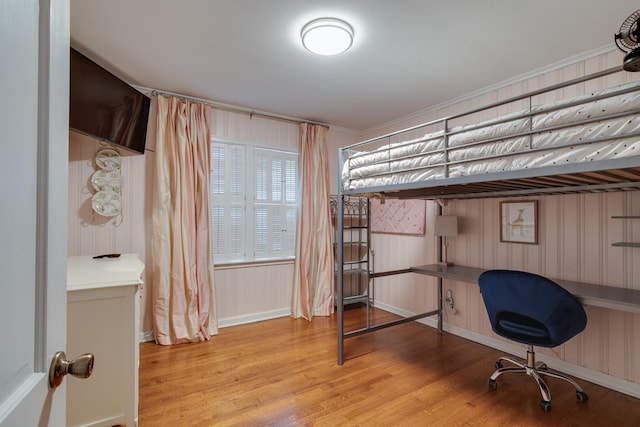 unfurnished bedroom featuring wood finished floors