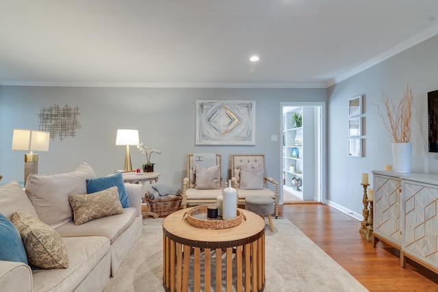 living area with recessed lighting, crown molding, baseboards, and wood finished floors