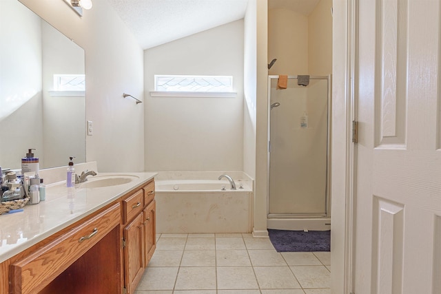 bathroom with a garden tub, a shower stall, tile patterned flooring, and vanity