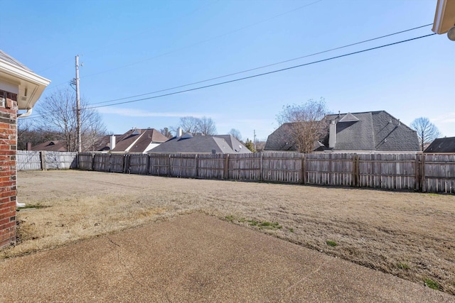 view of yard with a patio area and a fenced backyard