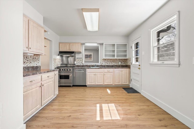 kitchen featuring under cabinet range hood, stainless steel appliances, a sink, decorative backsplash, and open shelves