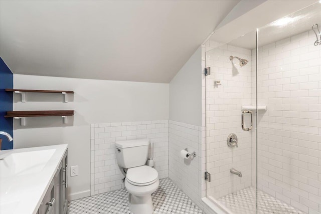 full bath with lofted ceiling, toilet, a stall shower, vanity, and tile patterned floors