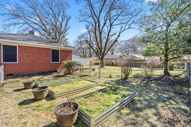 view of yard featuring a garden and fence