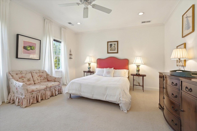 bedroom featuring baseboards, visible vents, crown molding, and light colored carpet