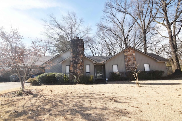 mid-century inspired home featuring a chimney