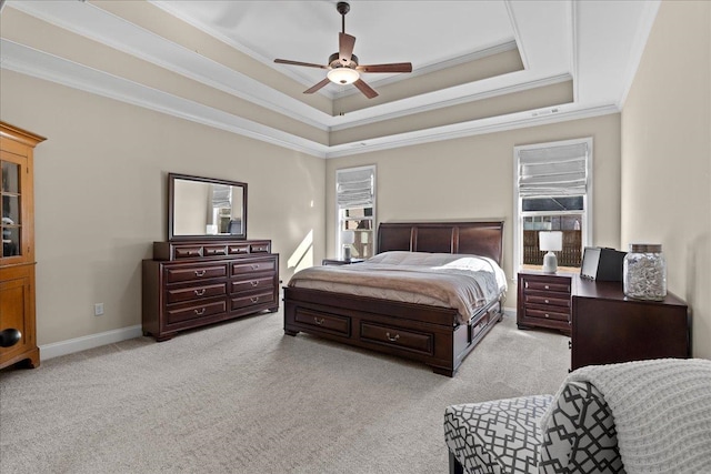 bedroom featuring ornamental molding, light colored carpet, multiple windows, and a raised ceiling
