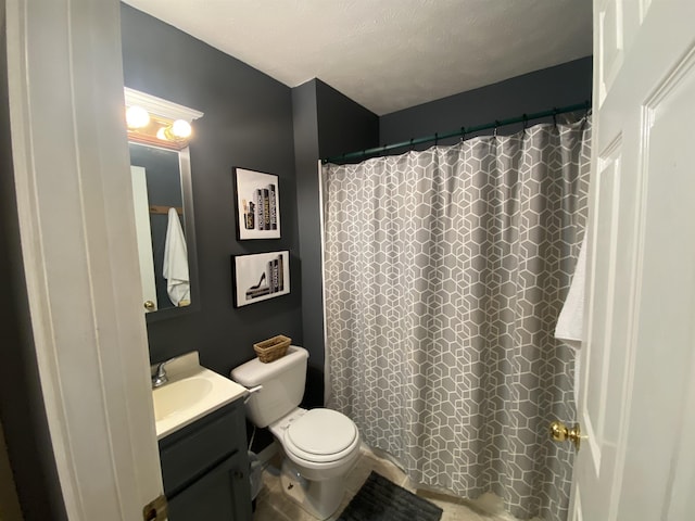 full bath featuring toilet, curtained shower, a textured ceiling, and vanity