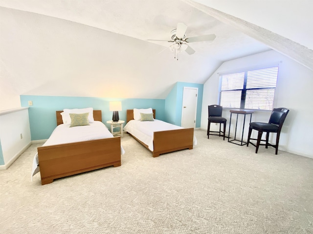 bedroom featuring vaulted ceiling, carpet floors, and a ceiling fan