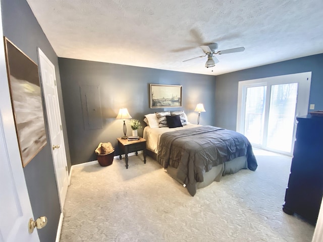 bedroom with a textured ceiling, ceiling fan, baseboards, access to exterior, and carpet