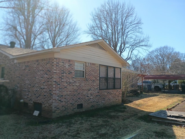 view of home's exterior featuring brick siding