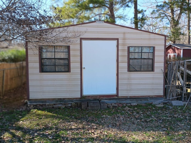 view of shed with fence