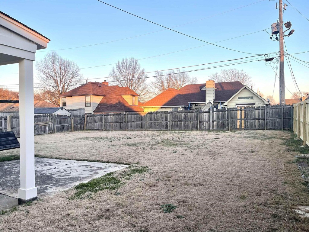 view of yard with a patio area and a fenced backyard