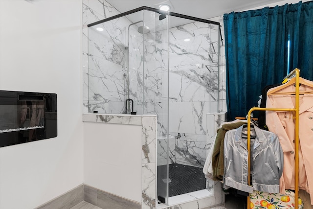 full bath featuring a marble finish shower