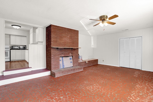 unfurnished living room with a brick fireplace, visible vents, a ceiling fan, and a textured ceiling