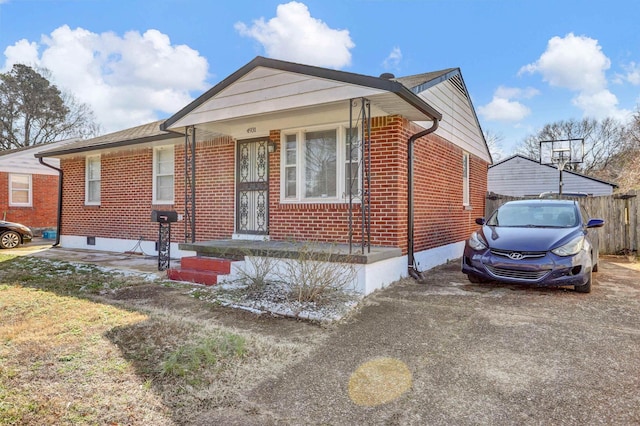 bungalow-style home featuring brick siding