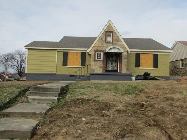 view of front of house with stone siding