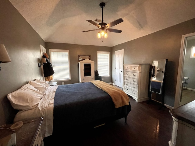 bedroom with lofted ceiling, baseboards, visible vents, and a ceiling fan