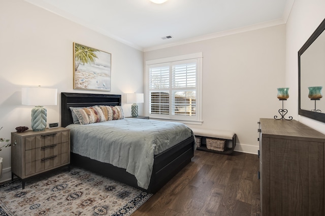 bedroom with baseboards, visible vents, dark wood-type flooring, and ornamental molding