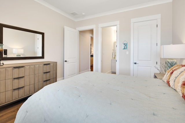 bedroom with ornamental molding, dark wood-style flooring, and visible vents