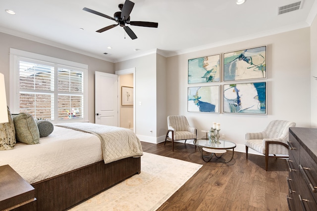 bedroom featuring ornamental molding, dark wood-style flooring, visible vents, and baseboards