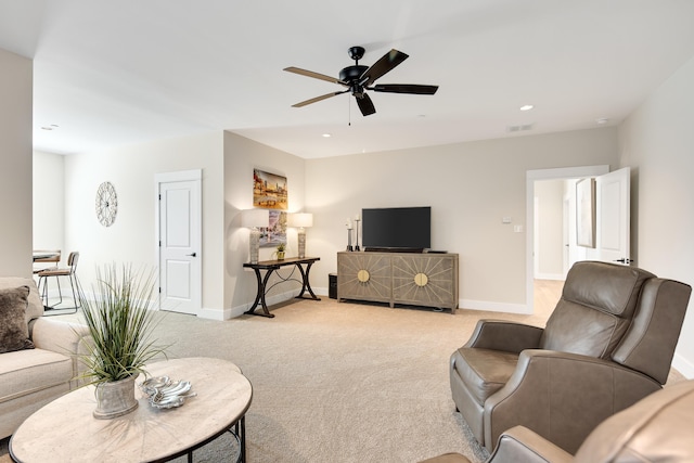 living room featuring ceiling fan, recessed lighting, light colored carpet, visible vents, and baseboards