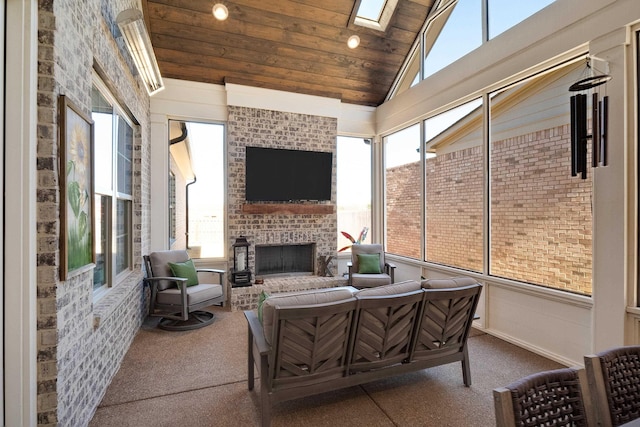 sunroom featuring vaulted ceiling with skylight, wood ceiling, and an outdoor brick fireplace