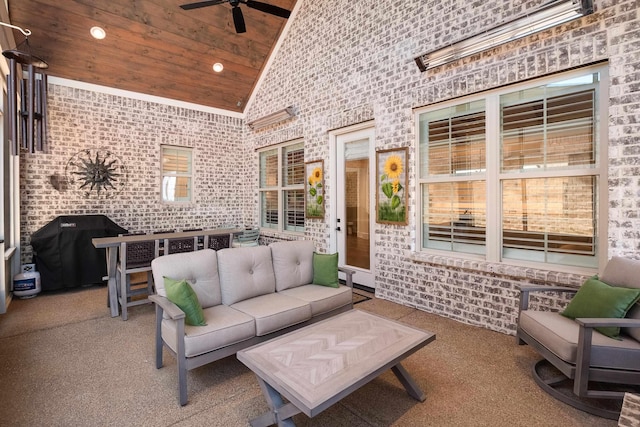 exterior space featuring a ceiling fan, wooden ceiling, brick wall, high vaulted ceiling, and recessed lighting