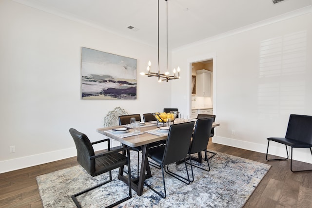 dining space with baseboards, visible vents, ornamental molding, and dark wood-style flooring