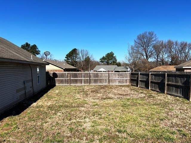 view of yard with a fenced backyard