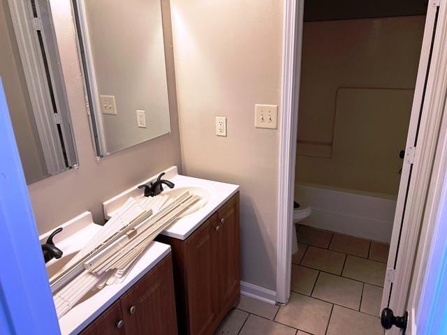 full bathroom featuring bathtub / shower combination, vanity, toilet, and tile patterned floors