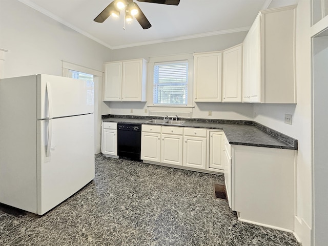 kitchen featuring plenty of natural light, black dishwasher, dark countertops, freestanding refrigerator, and a sink