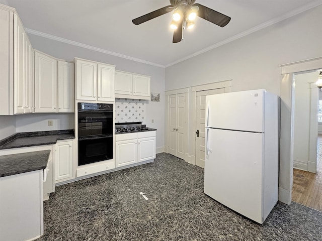 kitchen with ornamental molding, dark countertops, white cabinetry, and black appliances