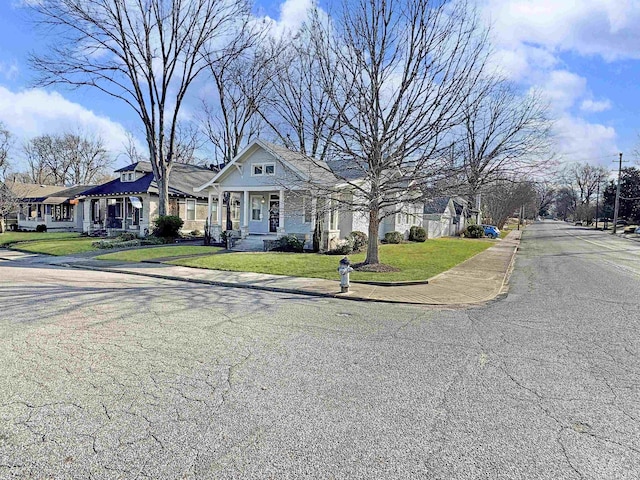 view of front of house featuring a residential view and a front yard