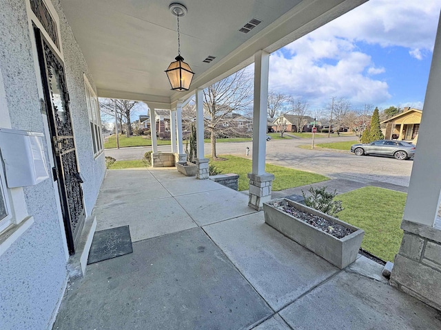 view of patio featuring visible vents