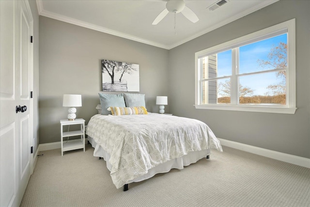 bedroom featuring baseboards, visible vents, light colored carpet, and ornamental molding