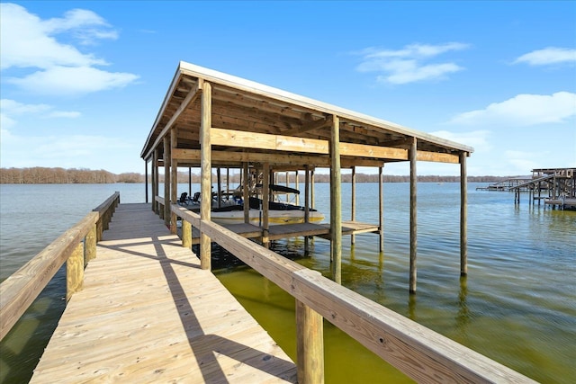 view of dock featuring a water view and boat lift