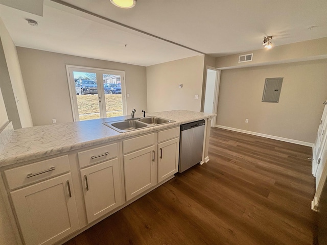 kitchen with dark wood-style flooring, light countertops, visible vents, a sink, and dishwasher