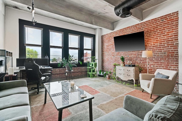 living area featuring brick wall