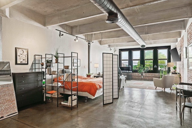 bedroom featuring finished concrete flooring