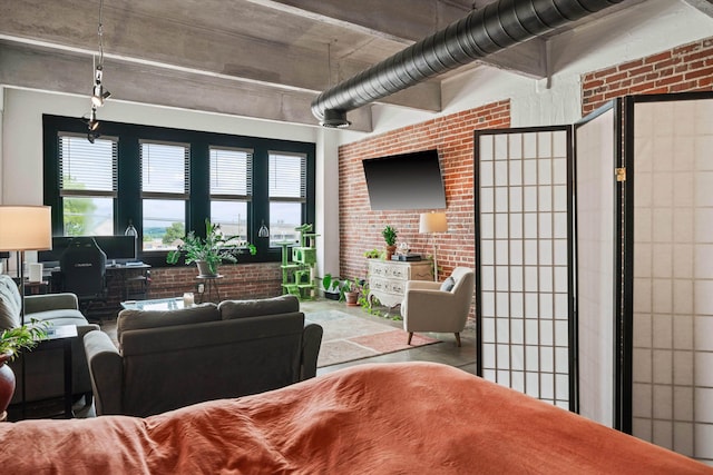 living area featuring brick wall