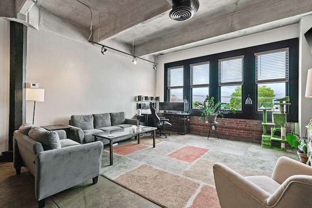 living area featuring concrete flooring and visible vents