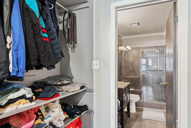 spacious closet featuring visible vents