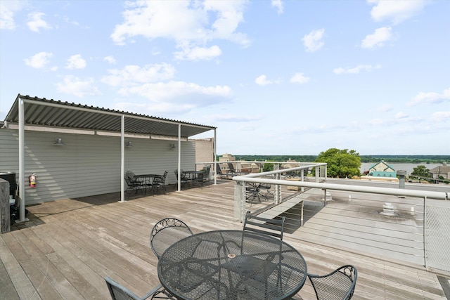 wooden deck with outdoor dining space